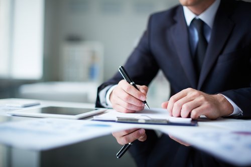 a man filling out paperwork