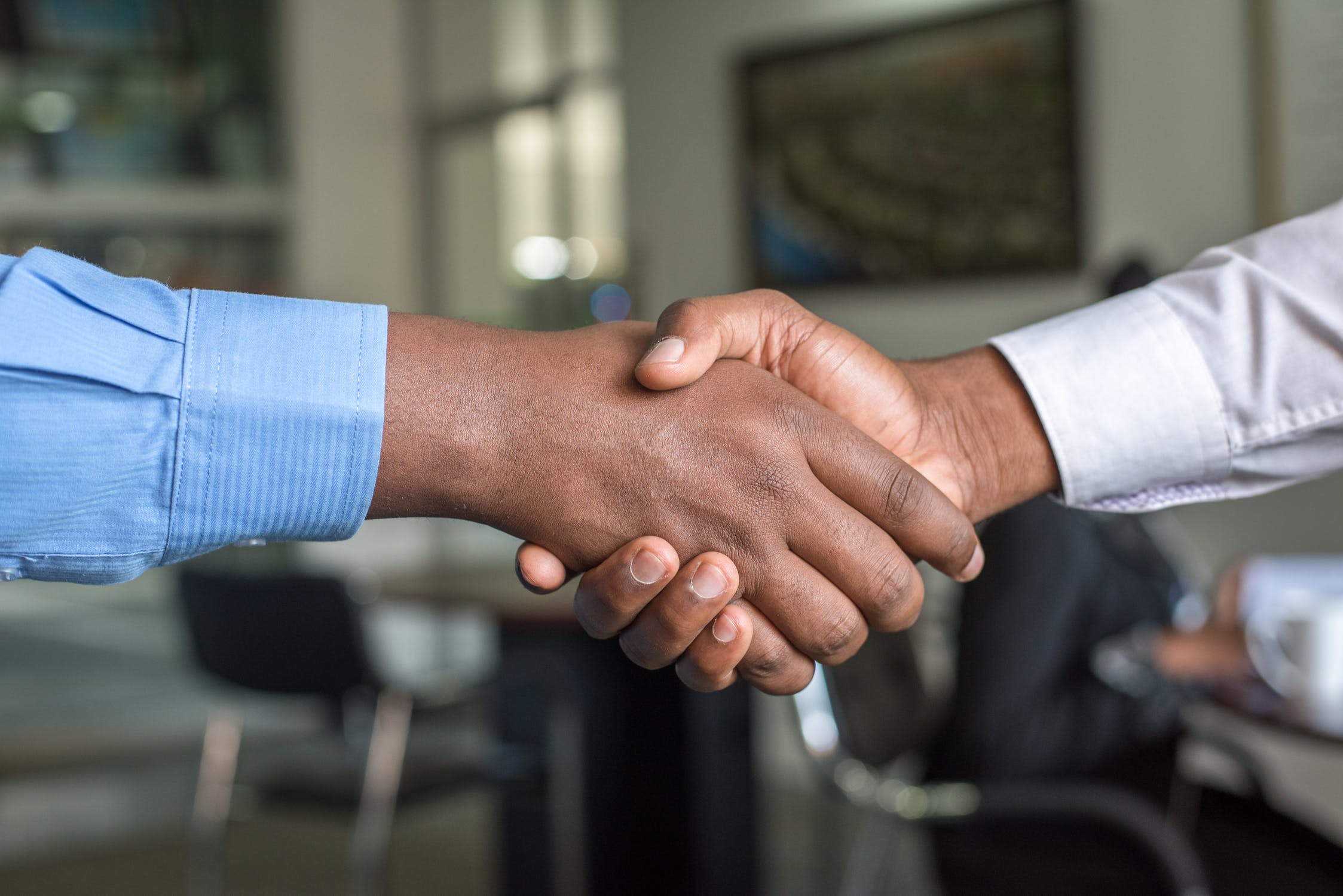 close up of two people shaking hands