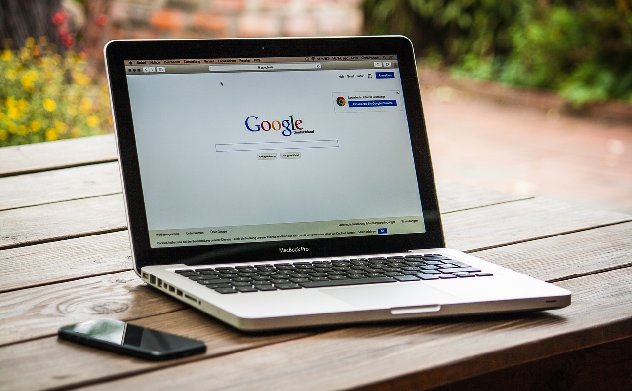 Macbook with a tab opened looking at Google