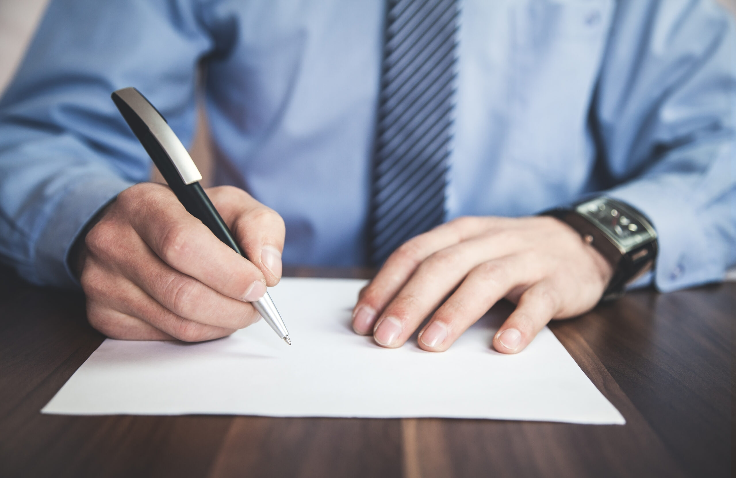 Businessman signing contract.